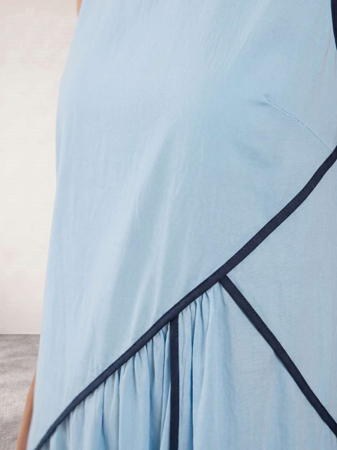 Flowing long dress with structured detail